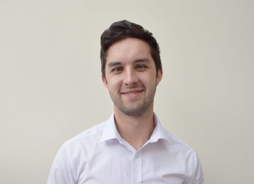 Portrait of Geddy Blake, General Manager at CMCA(UK), smiling confidently in a professional setting, representing his leadership in obsolescence management
